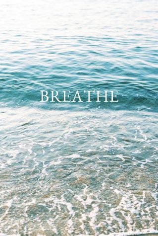 Serene ocean waves with 'Breathe' text inspire calm and reflection.